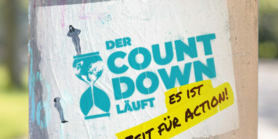 2022-01-26_Schulwettbewerb2 Bild auf einer Säule mit dem Spruch: Es ist ZEit für Action